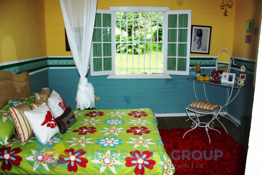 Interior shot bedroom showcasing the rustic charm and warm atmosphere of the family living spaces