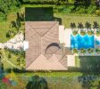 air photography from the complete lot, house, stylish pool and garden
