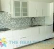 Sleek white kitchen with high-quality built-in equipment