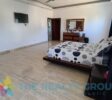 Huge master bedroom with doors to the walk-in closet and bathroom