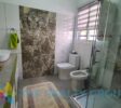 Modern bathrooms with premium fixtures in this 2.5-bathroom villa in Sosúa