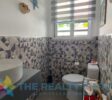Modern bathrooms with premium fixtures in this 2.5-bathroom villa in Sosúa