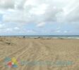 Pristine beach just 50 meters from the developed lot for sale in La Boca, Dominican Republic. Featuring crystal-clear waters and golden sand. Listed by The Realty Group
