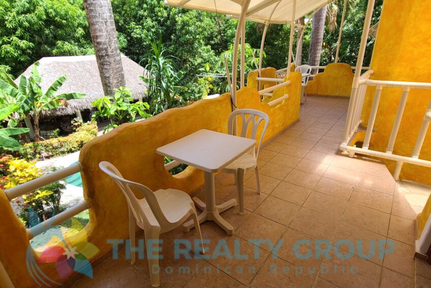 Studio Building: A two-level structure with five well-appointed studios, each with a kitchenette, full bathroom, and private terrace, ideal for guest comfort
