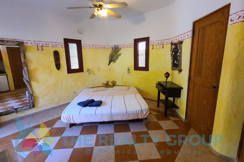 Studio Building: A two-level structure with five well-appointed studios, each with a kitchenette, full bathroom, and private terrace, ideal for guest comfort