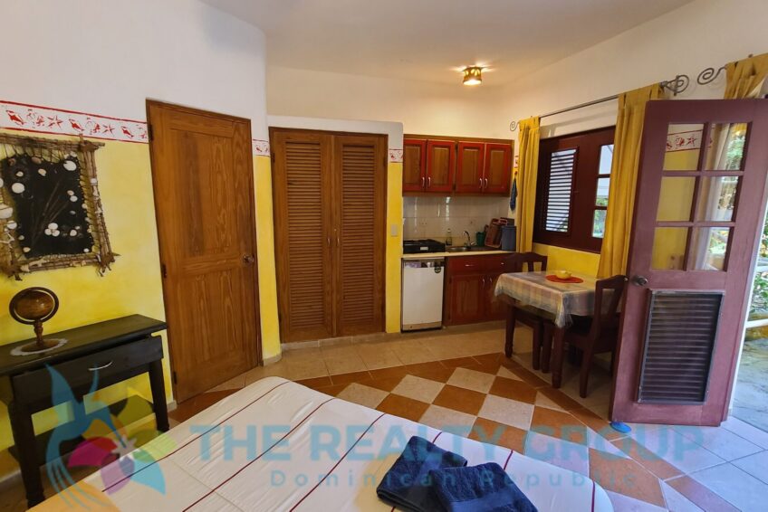 Studio Building: A two-level structure with five well-appointed studios, each with a kitchenette, full bathroom, and private terrace, ideal for guest comfort