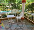 Relax by the beautiful kidney-shaped pool, just a minute