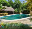 Relax by the beautiful kidney-shaped pool, just a minute