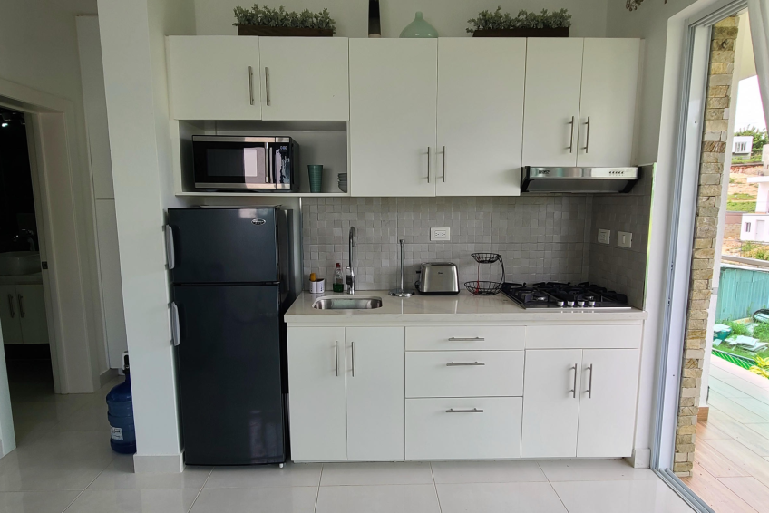 Fully equipped kitchen in Sosúa condos for sale with modern appliances