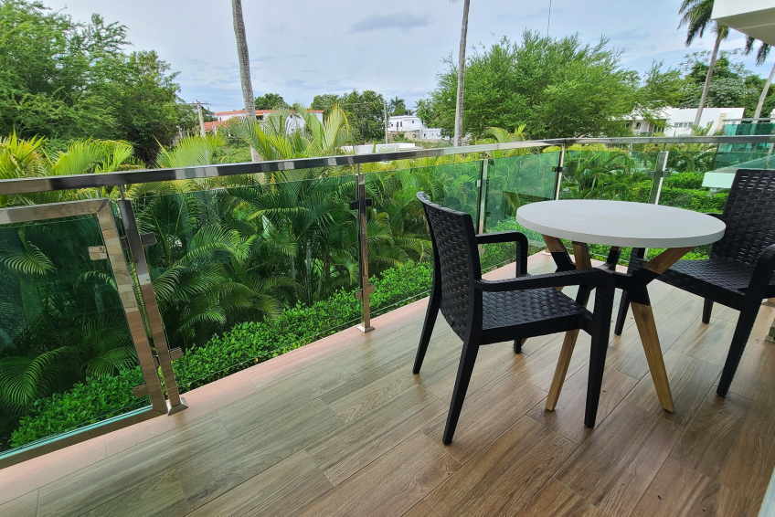 Covered terrace in Sosúa condos for sale overlooking private garden