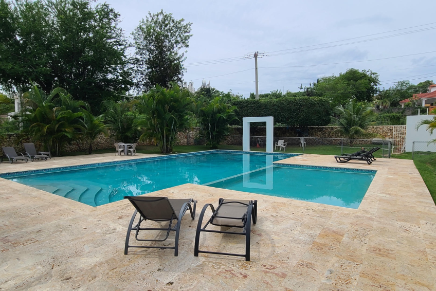 Large shared pool in gated Sosúa condos for sale perfect for leisure and guests