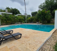 Large shared pool in gated Sosúa condos for sale perfect for leisure and guests