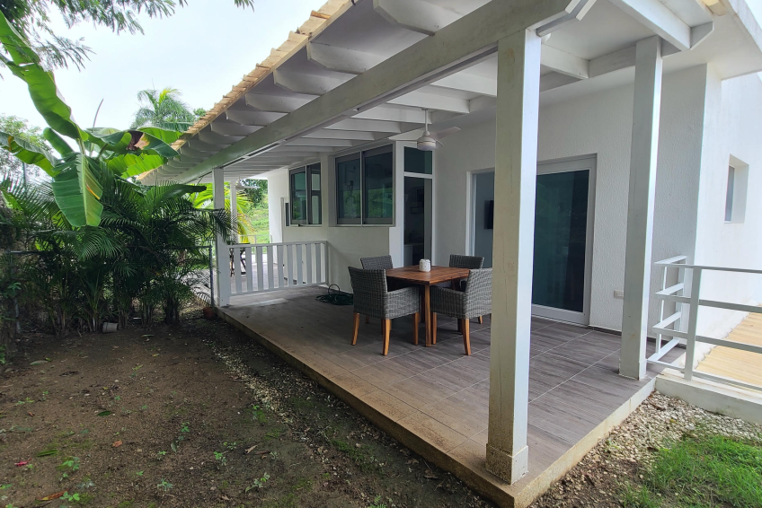Covered terrace in Sosúa condos for sale overlooking private garden