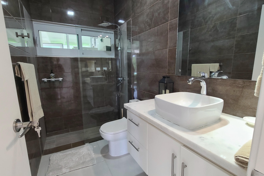 Modern bathroom in Sosúa condos for sale with walk-in shower and stylish fixtures