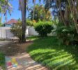 View of the garden of the fixer-upper in Cabarete East with walled lot