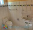 Bathroom in fixer-upper in Cabarete East with white tiles