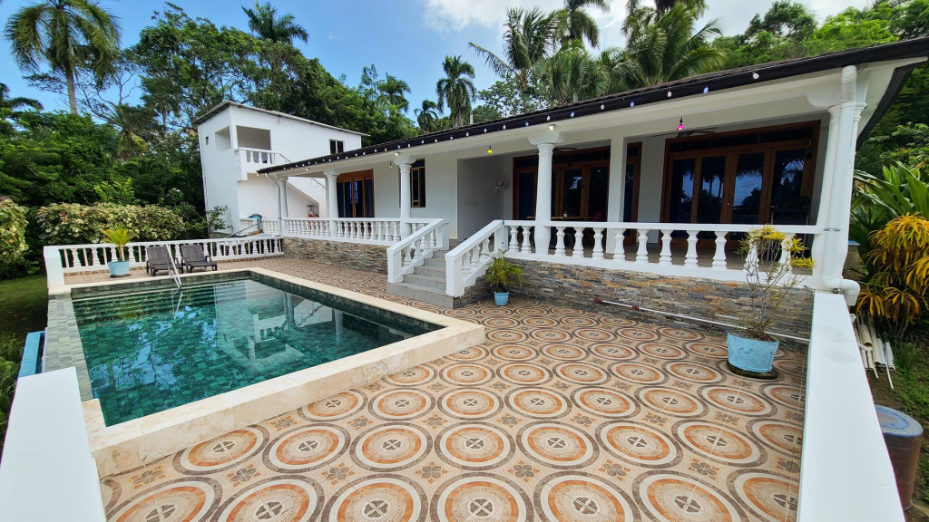 Front view of a beautiful villa with apartment and studio in Sosúa, built in 2020