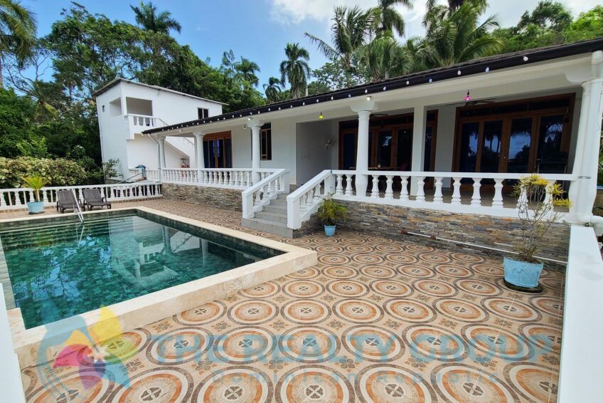 Front view of a beautiful villa with apartment and studio in Sosúa, built in 2020