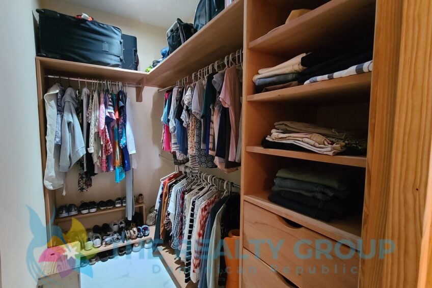 Elegant master bedroom with ensuite bathroom and walk-in closet in a beautiful villa with apartment and studio in Sosúa