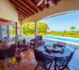 Luxury villa in Sosúa exterior with pool and gardens with ocean view.